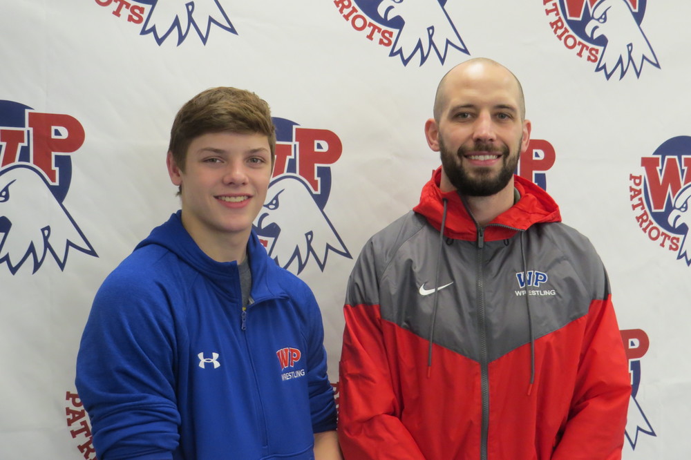 Photo: Pictured is a Wheeling Park High School senior wrestler Gabe Carman with Patriot wrestling coach Brian Leggett. In addition to being a standout wrestler, Carman is also an excellent student. He has a 4.06 GPA, and his favorite class is Computer Integrated Manufacturing. Carman said he plans to attend college, and he may pursue a career in engineering. 