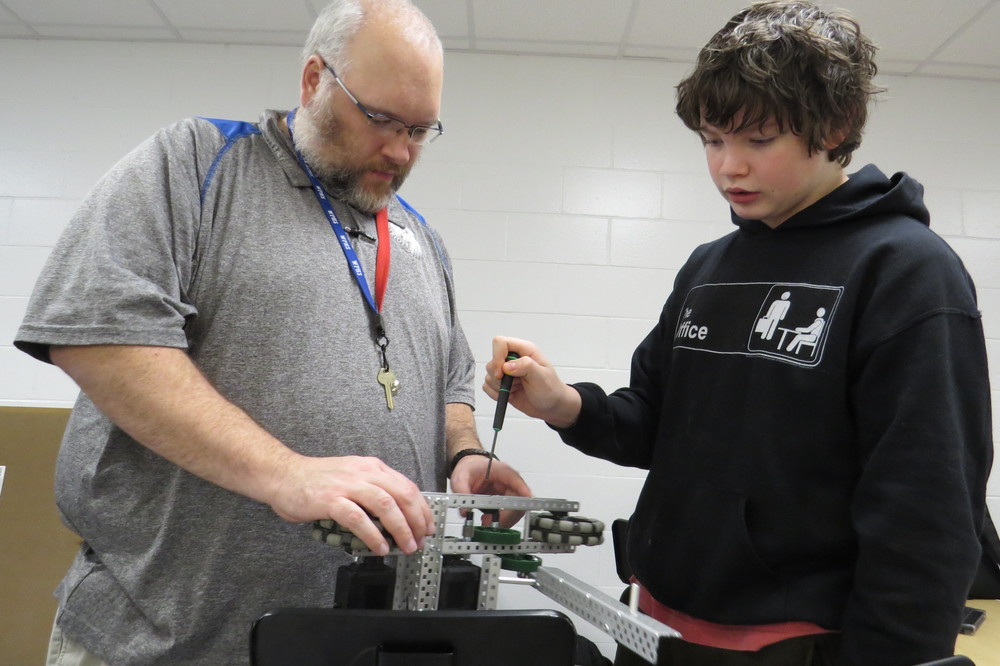  Pictured during robotics practice is Wheeling Park High School teacher and robotics coach Luke Shepherd with Patriot student Trenton Weaver. 