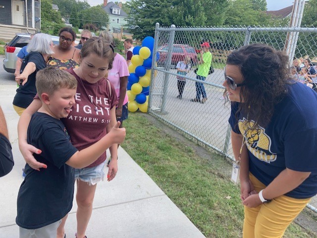 Madison Elementary Principal Andrea Trio greets a Cougar student at the school's Back-to-School Bash 