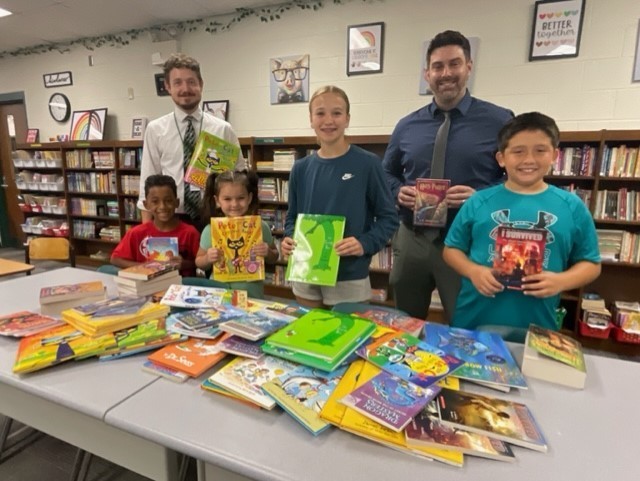 Pictured in front from left are Warwood School students Kylan Watson, Olivia Gregory, Ariana Swartz and Hayden Gonzalez. Shown in back from left are Assistant Robbie Demarest and Principal Jim Rowing.