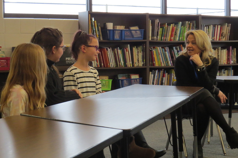 Ohio County Schools Superintendent Kim Miller speaks with Bethlehem Student Council members, from left, Arden Mowder, Ava Dominquez and Kira Murad