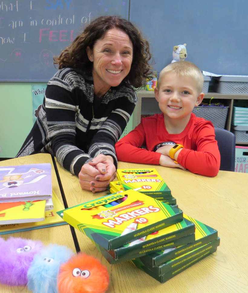 Middle Creek Counselor Pam Fazzini is shown with Road Runner student Carter Kovalski.