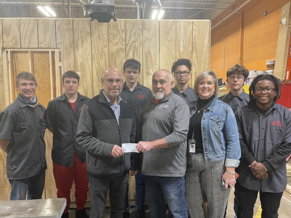 Pictured in front from left are Northern Panhandle Home Builders Association President Jim Baker, Wheeling Park Career and Technical Education teacher Wil Myers and Park Assistant Principal and CTE Director Stephanie Bugaj. In the second row from left are Patriot students in the CTE Carpentry Program (Known as “Park Builders”) Wyatt Stingle, Trent Werner, Brock Hinebaugh, Rayvon Dunn, Zackery Bruce and Kanye Mayfield.